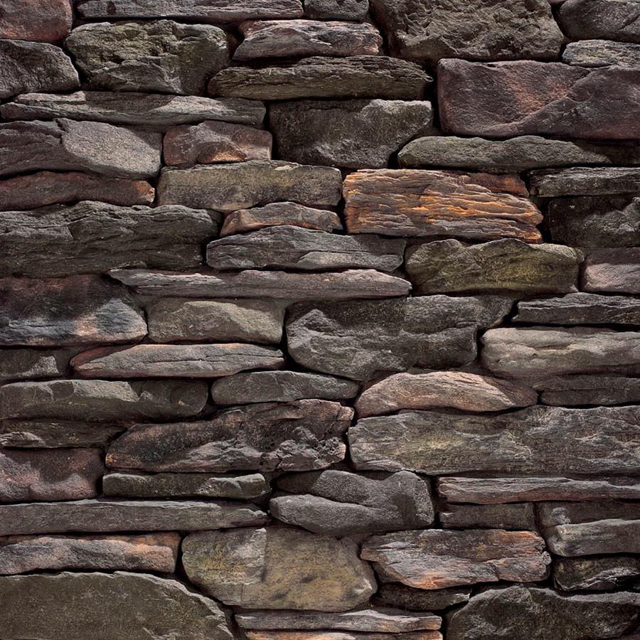 Manufactured stone Bluffstone is offered in Coosbay in this dry stacked stone wall.