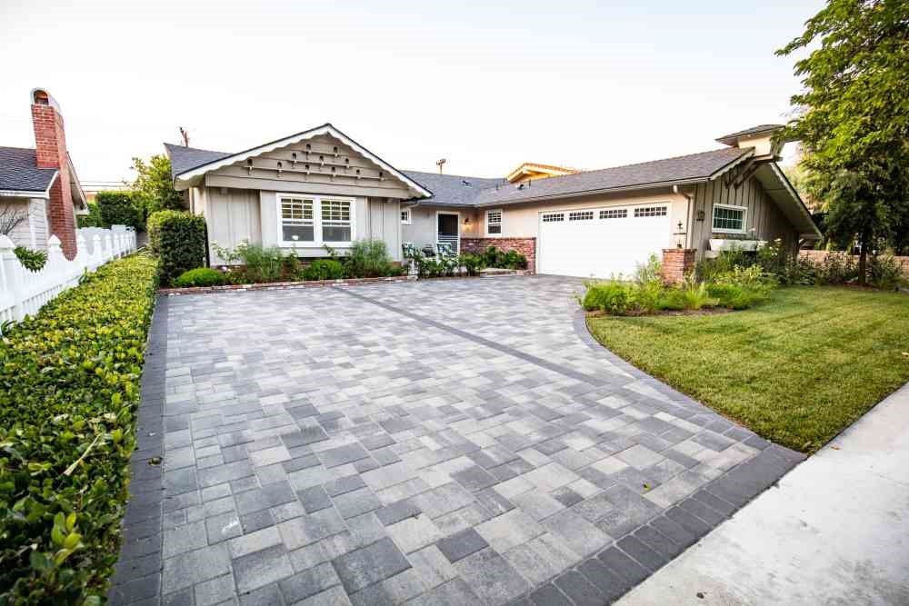 Interlocking concrete pavers can give a more rustic look to oyur driveway.