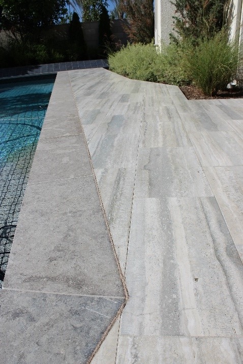 Variety of custom edge profiles on pool coping, showcasing tailored design options from smooth to textured finishes for personalized pool aesthetics.