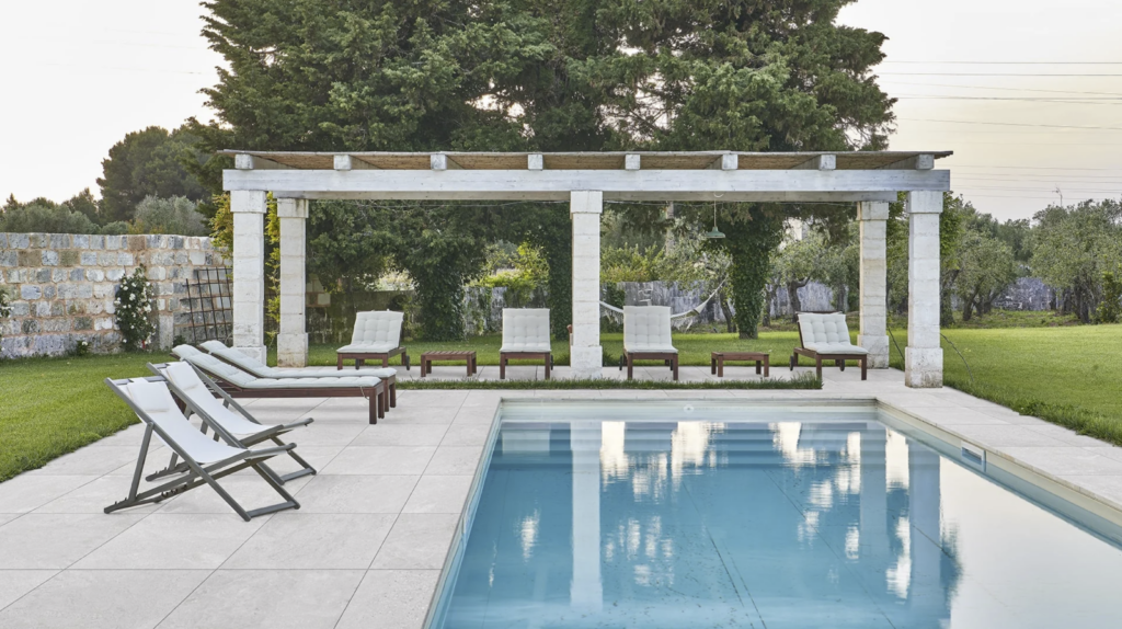 Elegant porcelain patio and pool coping, providing a low-maintenance, stain-resistant surface ideal for stylish, functional outdoor living spaces.