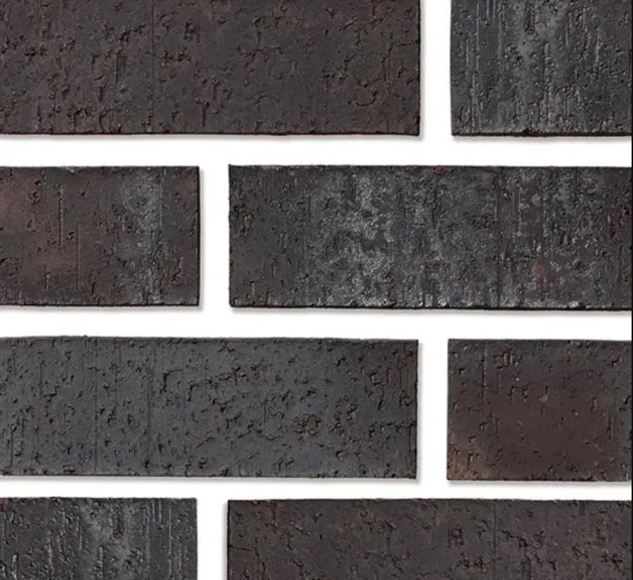 Detailed pattern of Coal Creek thin brick tiles, showcasing the classic and timeless appeal of natural brick in a seamless arrangement.