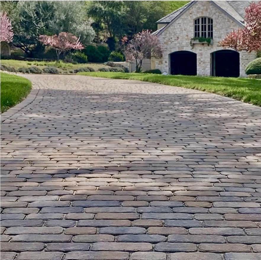 Elegant driveway using 2 Belgard Belgian Stone Rustic Charm pavers.