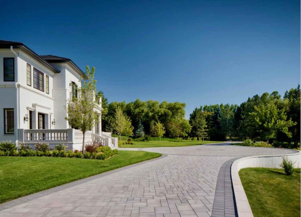 Modern driveway and parking lot using Belgard Catalina Grana pavers.