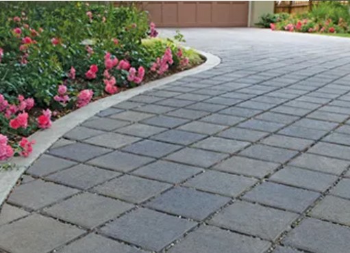 Walkway and driveway in front of house using Basalite Permeable pavers.