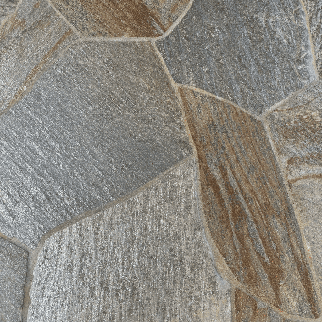 Idaho Storm Mountain Quartzite Flagstone with irregular pattern, light to medium gray tones, metallic veining, and warm brown highlights