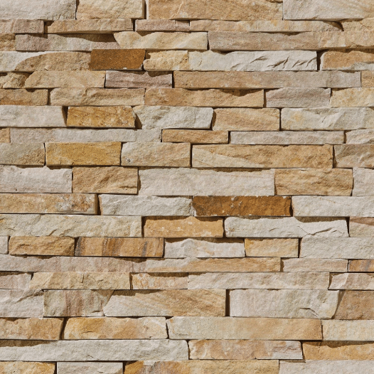 Tight-fit natural stone veneer wall in warm gold tones, with stones fitted closely and almost no visible grout