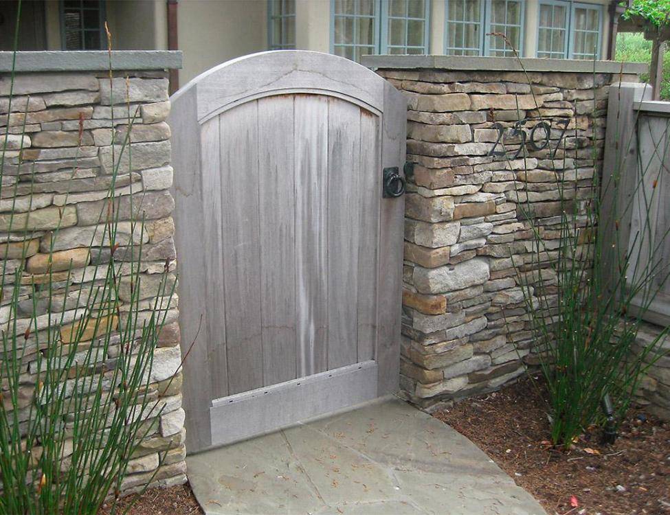 Weathered Fieldstone for freestanding outside wall and natural Bluestone Caps