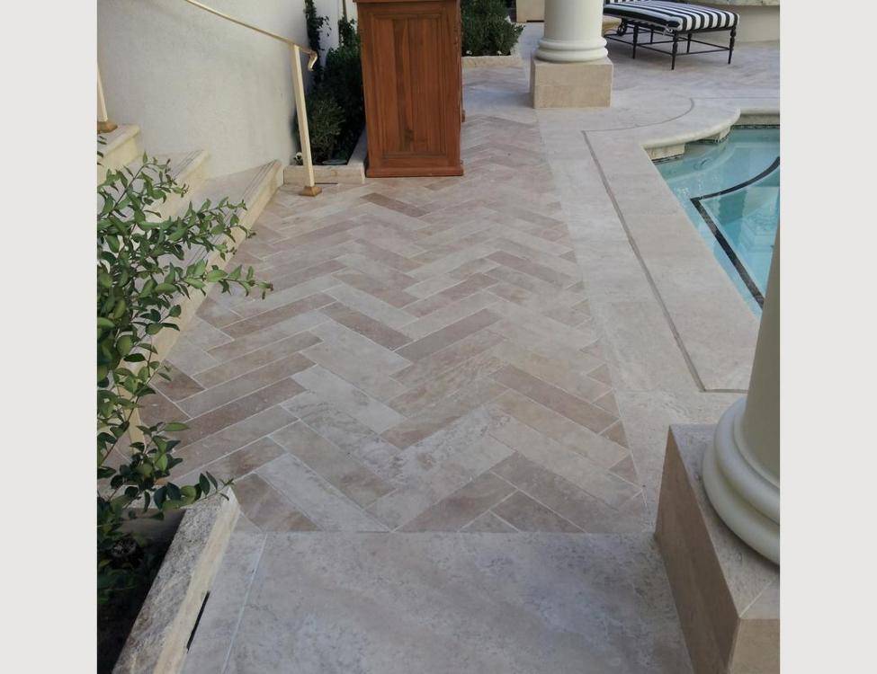 Natural Stone: Peruvian Travertine for pool deck surfaces and pool coping